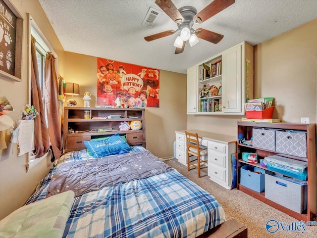 812 Mitwede St SW, Hartselle, AL 35640 - bedroom with carpet floors, a textured ceiling, and a ceiling fan