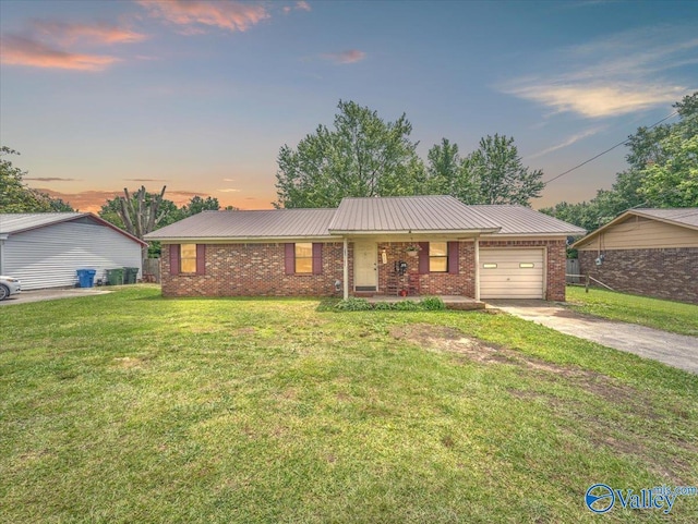 812 Mitwede St SW, Hartselle, AL 35640 - ranch-style home featuring a garage, brick siding, driveway, and a front yard