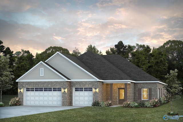 view of front facade featuring a garage and a yard