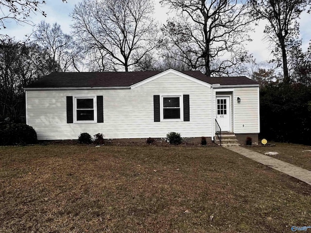 view of front of home with a front lawn