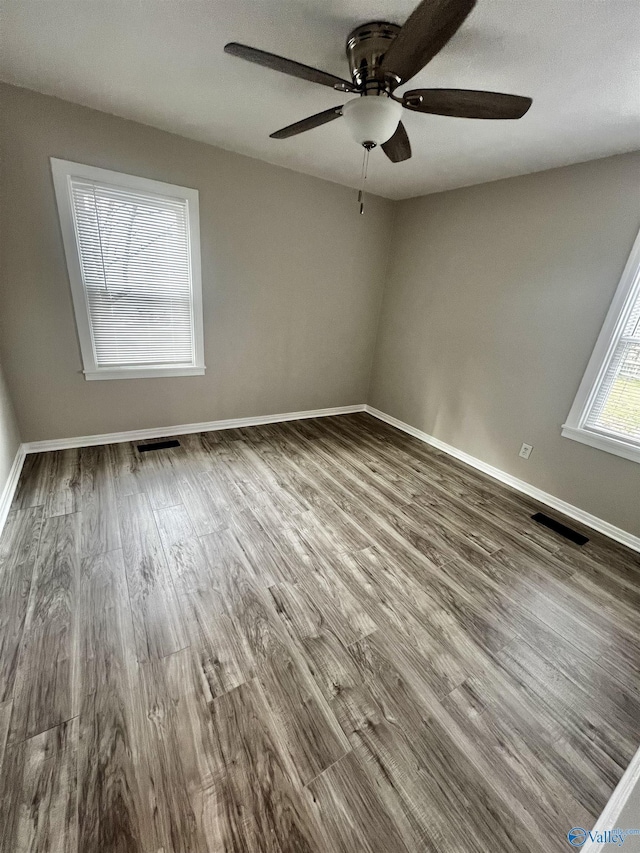 unfurnished room featuring hardwood / wood-style floors and ceiling fan