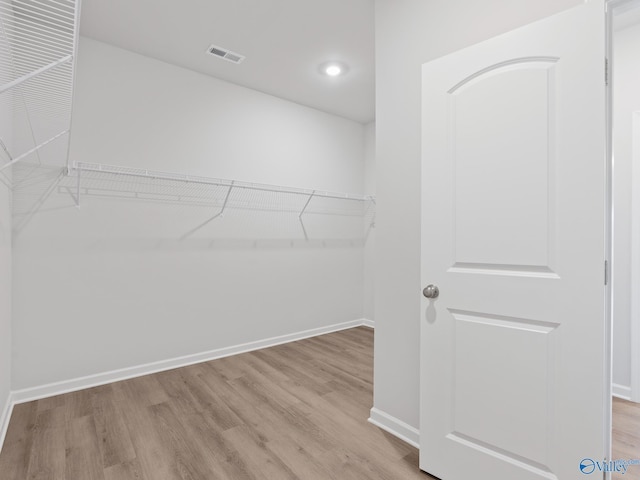walk in closet with visible vents and light wood-style flooring