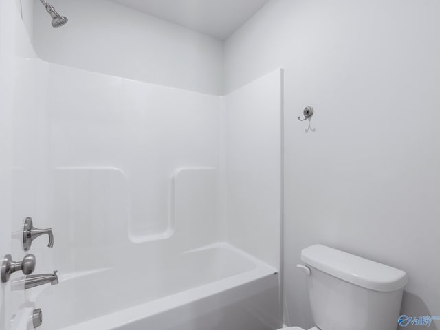 full bathroom featuring bathing tub / shower combination and toilet