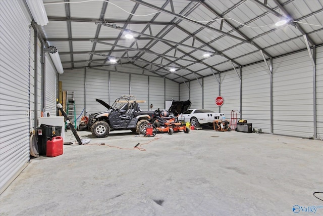 garage with metal wall and a garage door opener