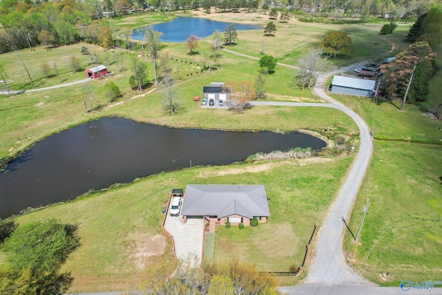 birds eye view of property with a water view and a rural view