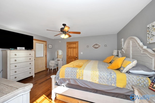 bedroom with dark hardwood / wood-style floors and ceiling fan