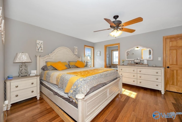 bedroom featuring ceiling fan and dark hardwood / wood-style flooring