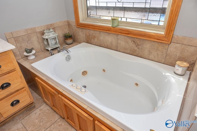 bathroom featuring vanity and a bath