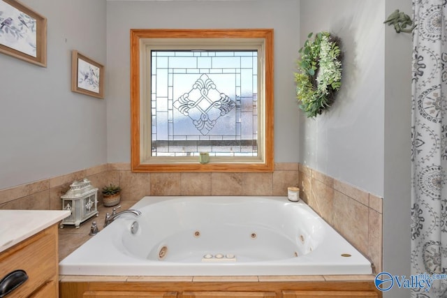 bathroom featuring a bathing tub and vanity