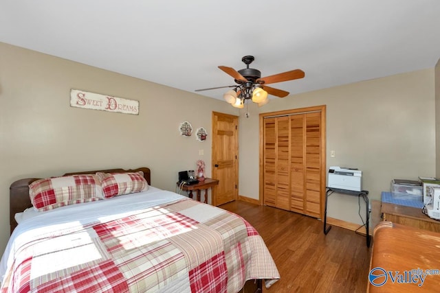 bedroom featuring hardwood / wood-style floors, a closet, and ceiling fan