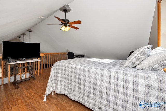 bedroom featuring vaulted ceiling, wood-type flooring, and ceiling fan