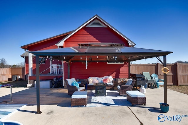 exterior space with a gazebo and an outdoor hangout area