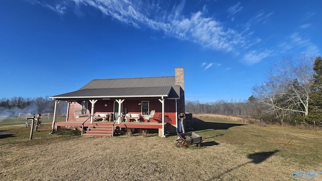 view of front of house with a porch and a front lawn