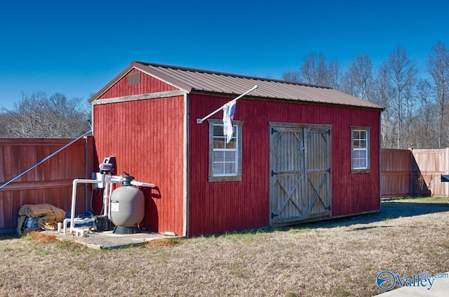 view of outbuilding with a lawn