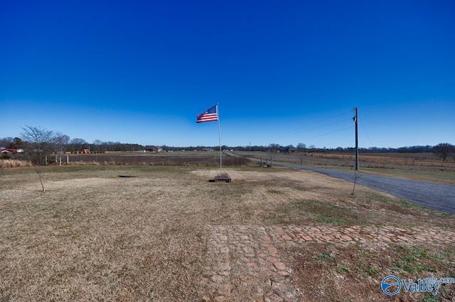 view of yard with a rural view