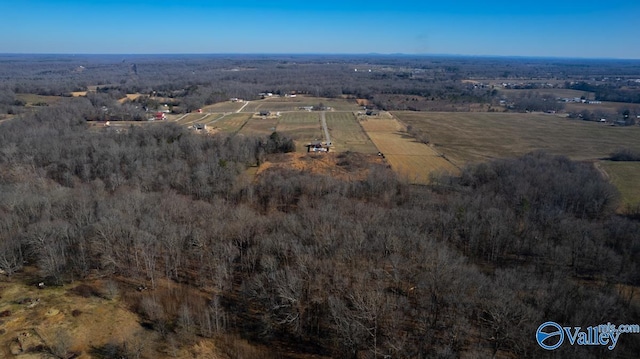 birds eye view of property with a rural view