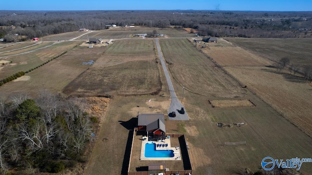 birds eye view of property with a rural view