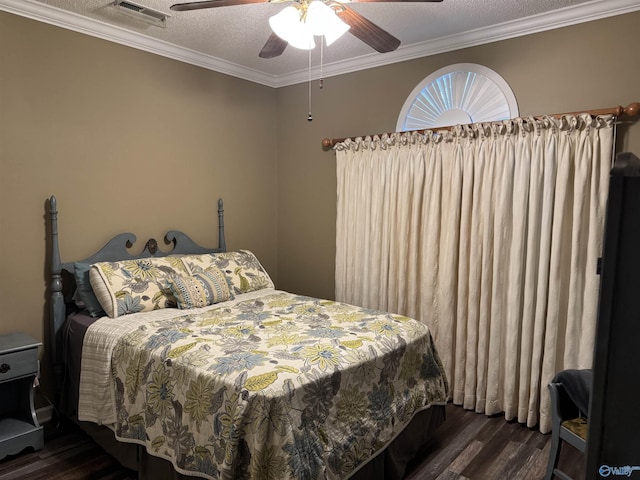 504 Sussex Dr SW, Huntsville, AL 35824 - bedroom with wood finished floors, a textured ceiling, crown molding, and a ceiling fan