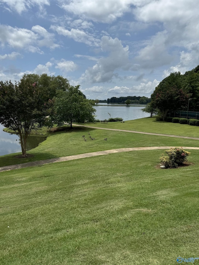 504 Sussex Dr SW, Huntsville, AL 35824 - surrounding community with a water view and a lawn