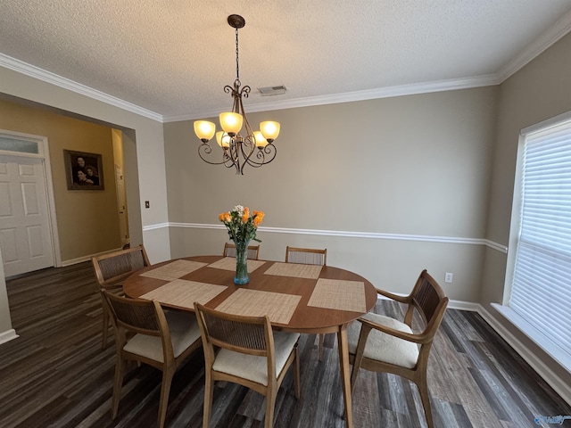 504 Sussex Dr SW, Huntsville, AL 35824 - dining space with a chandelier, dark wood-style flooring, a textured ceiling, baseboards, and ornamental molding