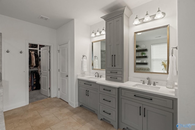 bathroom with tile patterned flooring and vanity