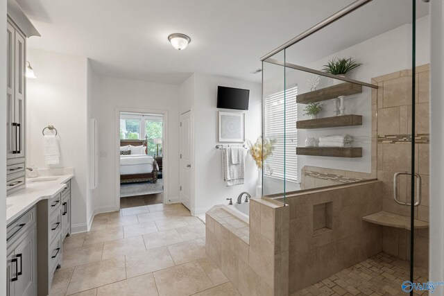 bathroom featuring vanity, tile patterned flooring, and toilet