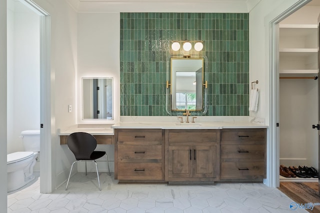 bathroom featuring vanity, tile patterned flooring, toilet, and tile walls