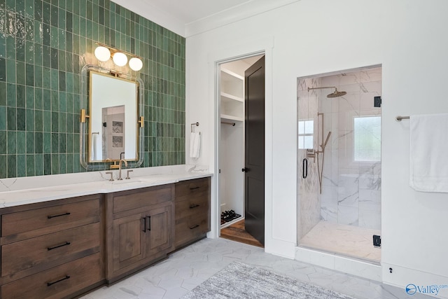 bathroom featuring tile patterned flooring, an enclosed shower, vanity, tile walls, and ornamental molding