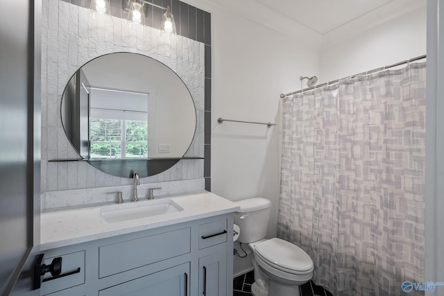 bathroom featuring tile patterned floors, vanity, and toilet