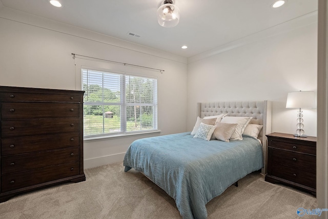 bedroom featuring light carpet and ornamental molding