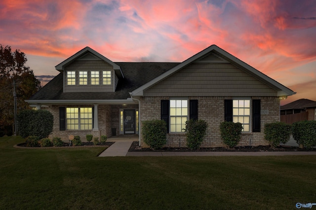 view of front of home with a yard