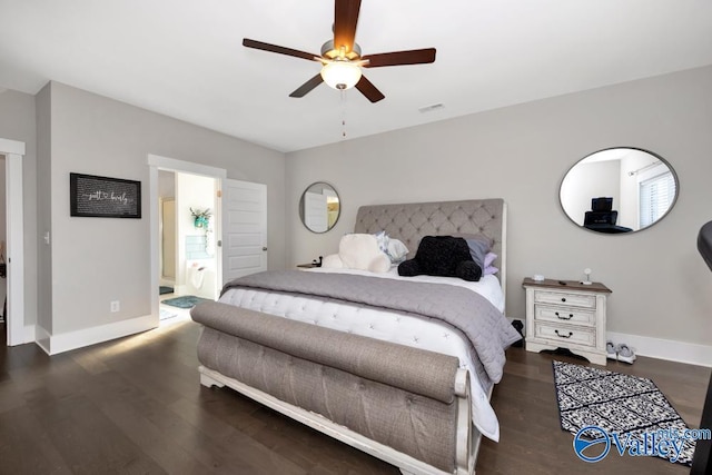 bedroom with dark wood-type flooring, ceiling fan, and ensuite bath