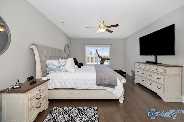 bedroom with dark wood-type flooring and ceiling fan