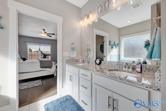 bathroom featuring vanity, tile patterned floors, and ceiling fan