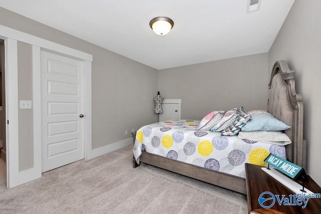 bedroom featuring light carpet