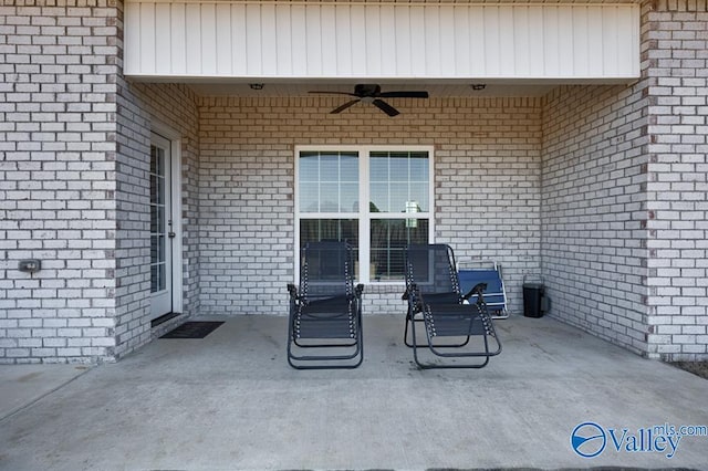 view of patio featuring ceiling fan