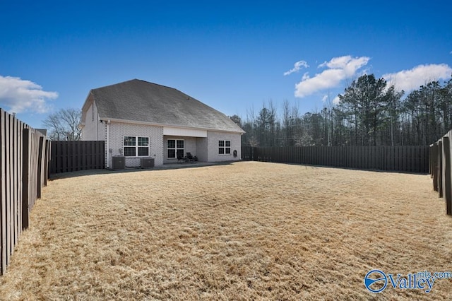 rear view of property featuring central AC unit