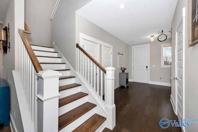 entryway with dark wood-type flooring