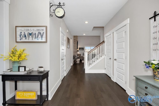 hall with dark hardwood / wood-style flooring