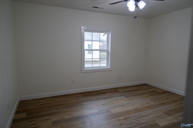 unfurnished room with hardwood / wood-style flooring and ceiling fan