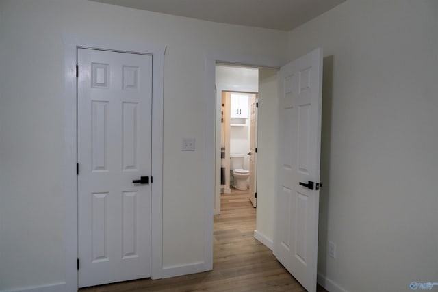 hall with light hardwood / wood-style flooring