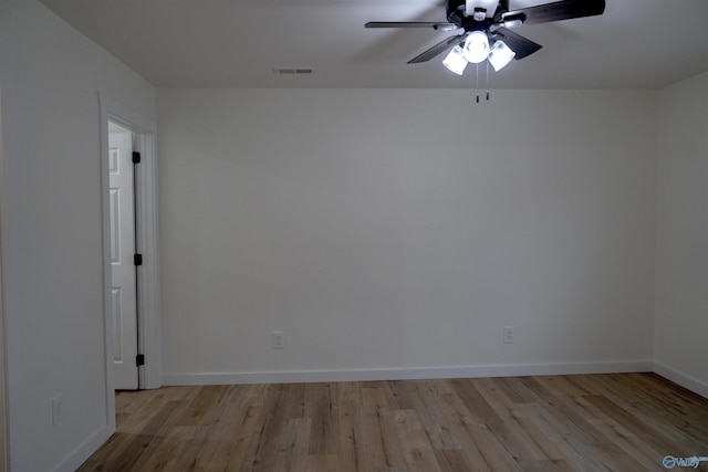 empty room with ceiling fan and light wood-type flooring
