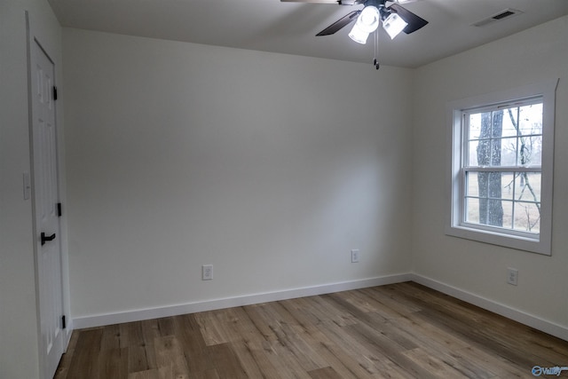 empty room featuring ceiling fan and light hardwood / wood-style flooring