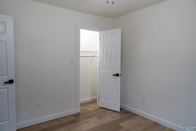 unfurnished bedroom with light hardwood / wood-style flooring