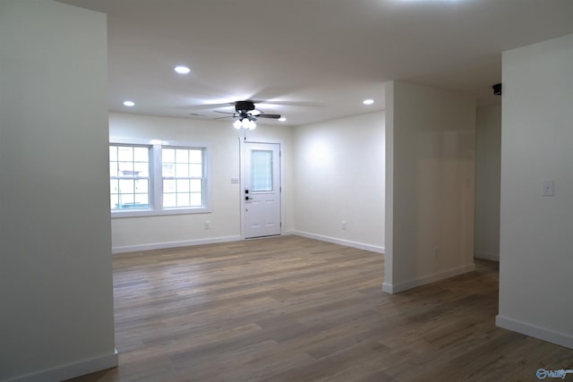 spare room with dark wood-type flooring and ceiling fan