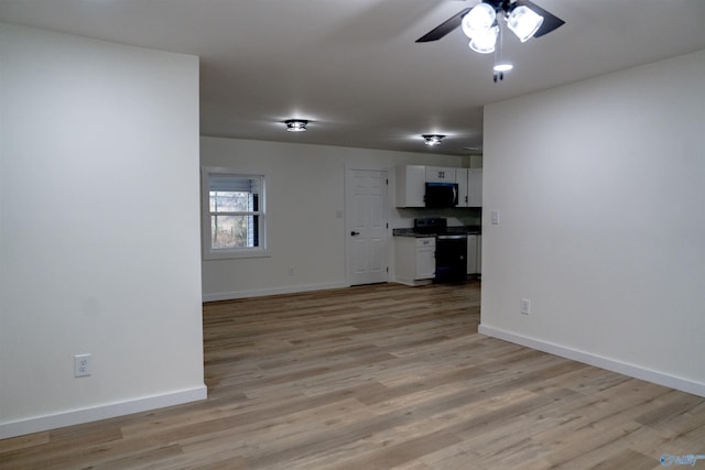unfurnished living room with ceiling fan and light hardwood / wood-style floors