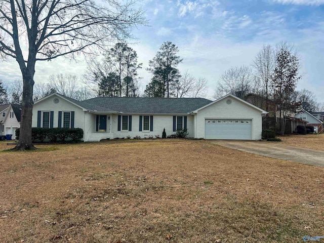 ranch-style house with a garage and a front yard