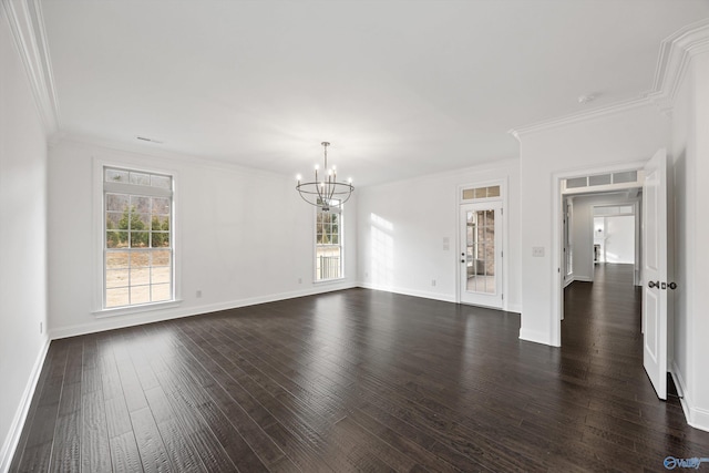 empty room featuring crown molding, dark wood-type flooring, and an inviting chandelier