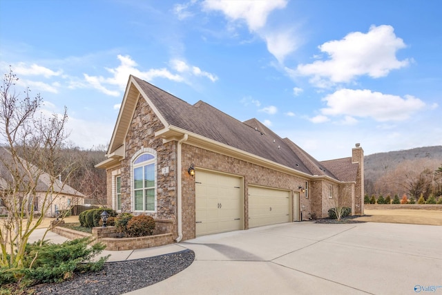 view of side of property with a garage