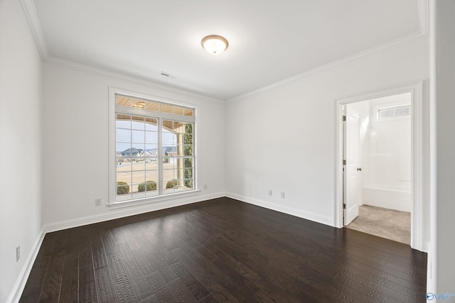 spare room with crown molding and dark wood-type flooring